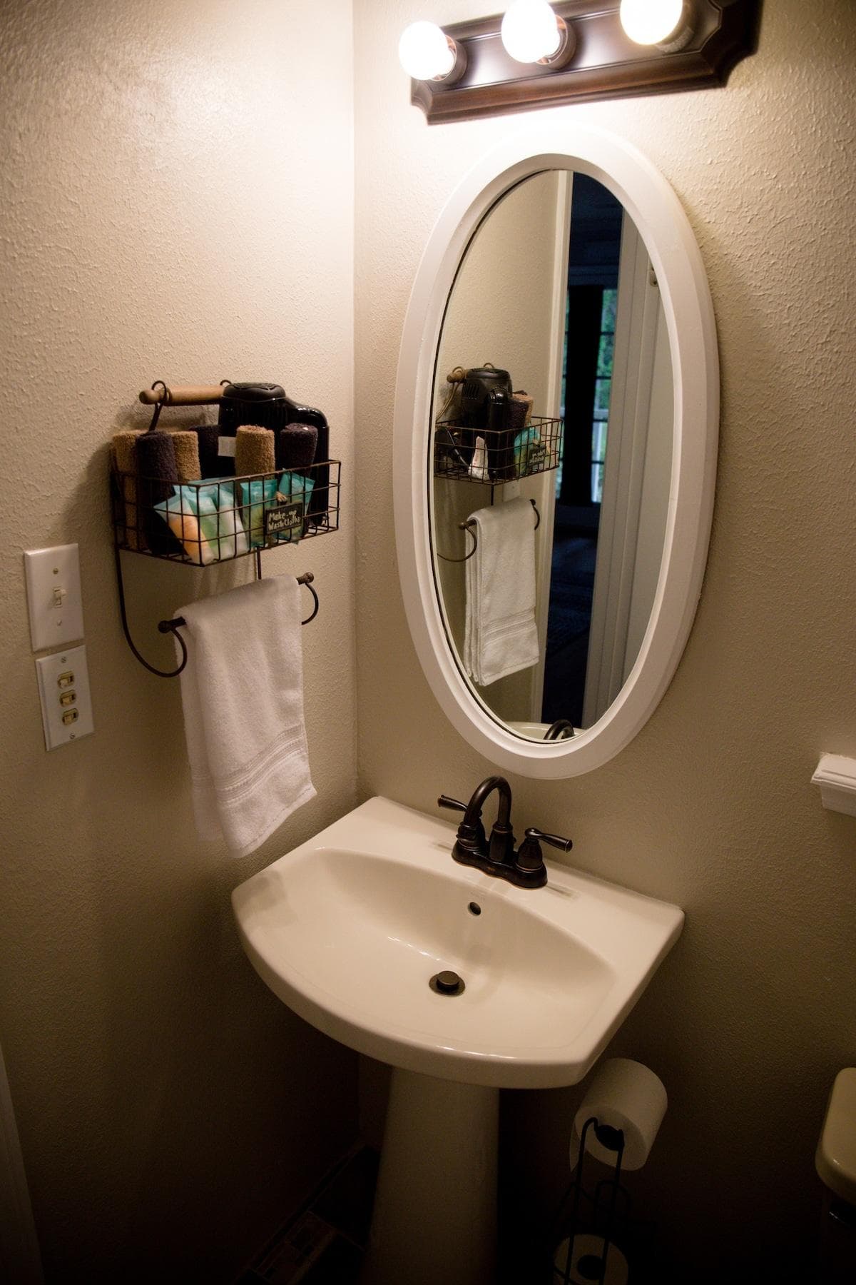 The bathroom has a shower/tub combo and a pedestal sink.  Toiletries are provided.  Hairdryer and towels are stocked for your use.